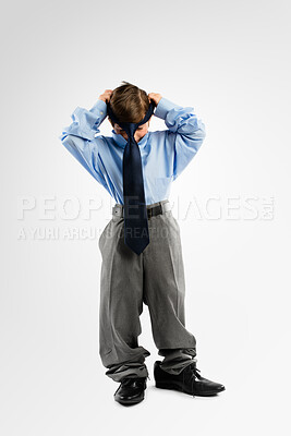 Buy stock photo Child, boy and business clothes in studio for childhood growth, future and ambition with big shoes. Male kid, outfit and corporate attire on white background for development, dressing and family heir