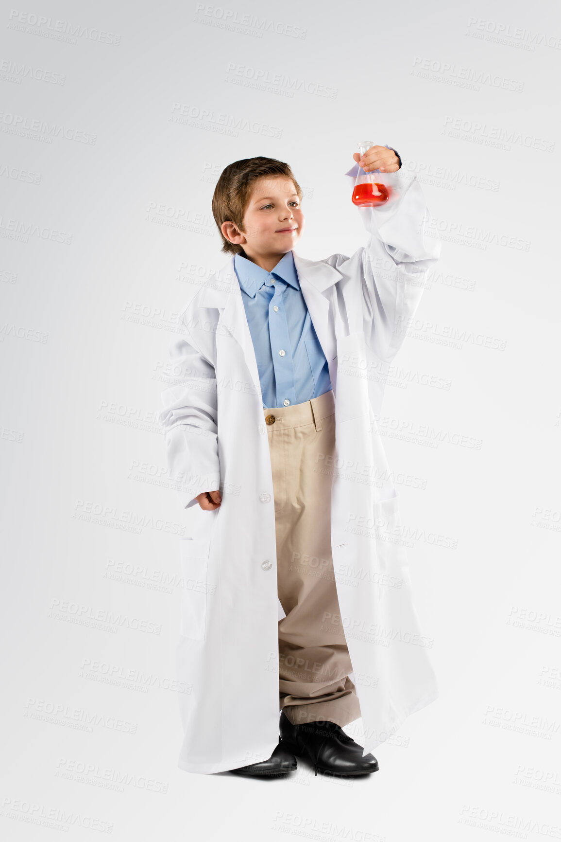 Buy stock photo Science, chemicals and boy child in studio doing a chemistry experiment, project or discovery. Liquid, glass beaker and full body of kid scientist model doing scientific research by white background.