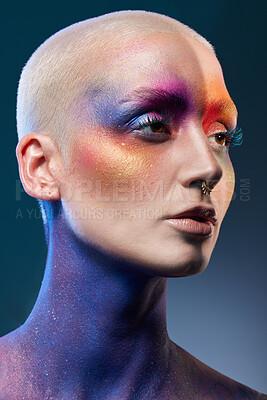 Buy stock photo Studio shot of a young woman posing with multi-coloured paint on her face