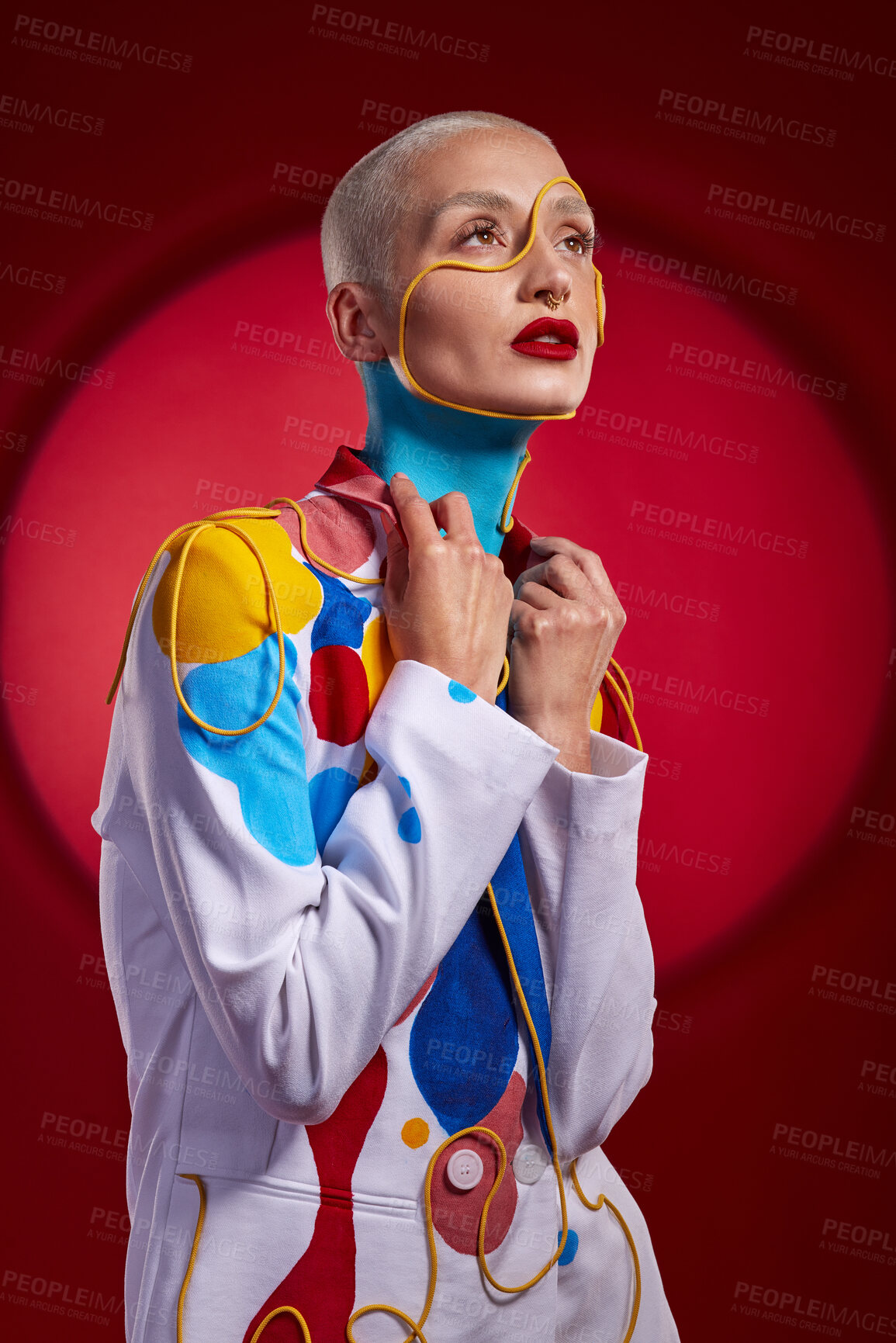 Buy stock photo Studio shot of a stylish young woman posing against a red background