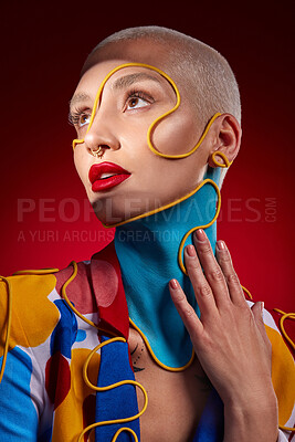 Buy stock photo Studio shot of a stylish young woman posing against a red background