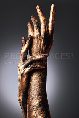 Buy stock photo Cropped shot of an unrecognisable woman posing alone in the studio with paint on her hands