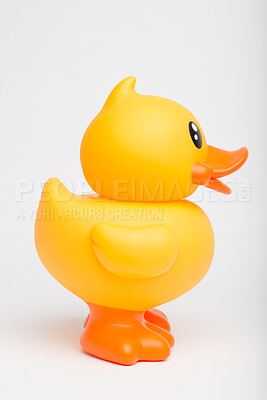 Buy stock photo Rubber, duck and toy in studio for pool, playing and children entertainment with fun squeaky sound. Plastic bird, object and white background for kids, bath and water with childhood games or activity