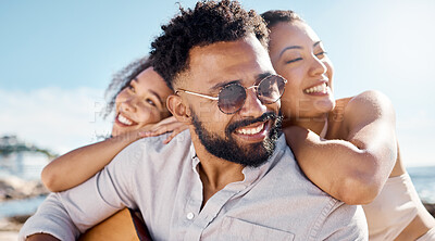 Buy stock photo Shot of a man at the beach with his two female friends