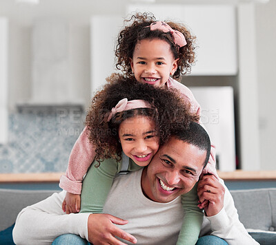 Buy stock photo Portrait of a father having fun with his two little daughters at home