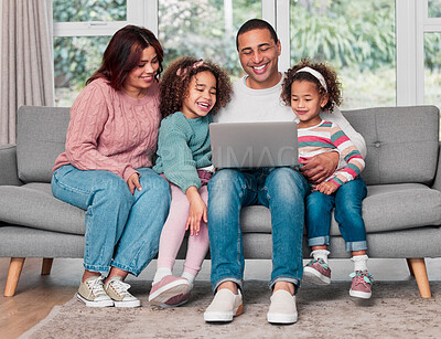 Buy stock photo Shot of a happy family using a laptop together at home