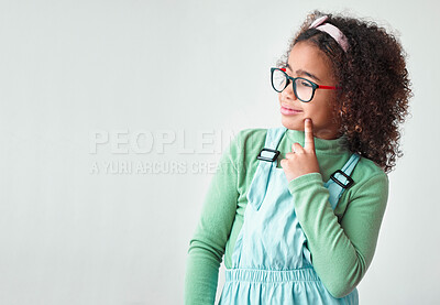 Buy stock photo Education, space and thinking with girl child in studio isolated on white background for school registration. Mockup, future or vision and African student with announcement or question for sign up