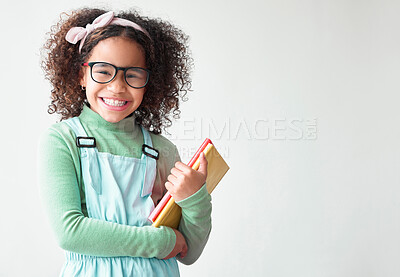 Buy stock photo Books, happy and portrait of child in studio with mockup space for education, learning and knowledge. Glasses, excited and girl kid student with scholarship for elementary school by white background.