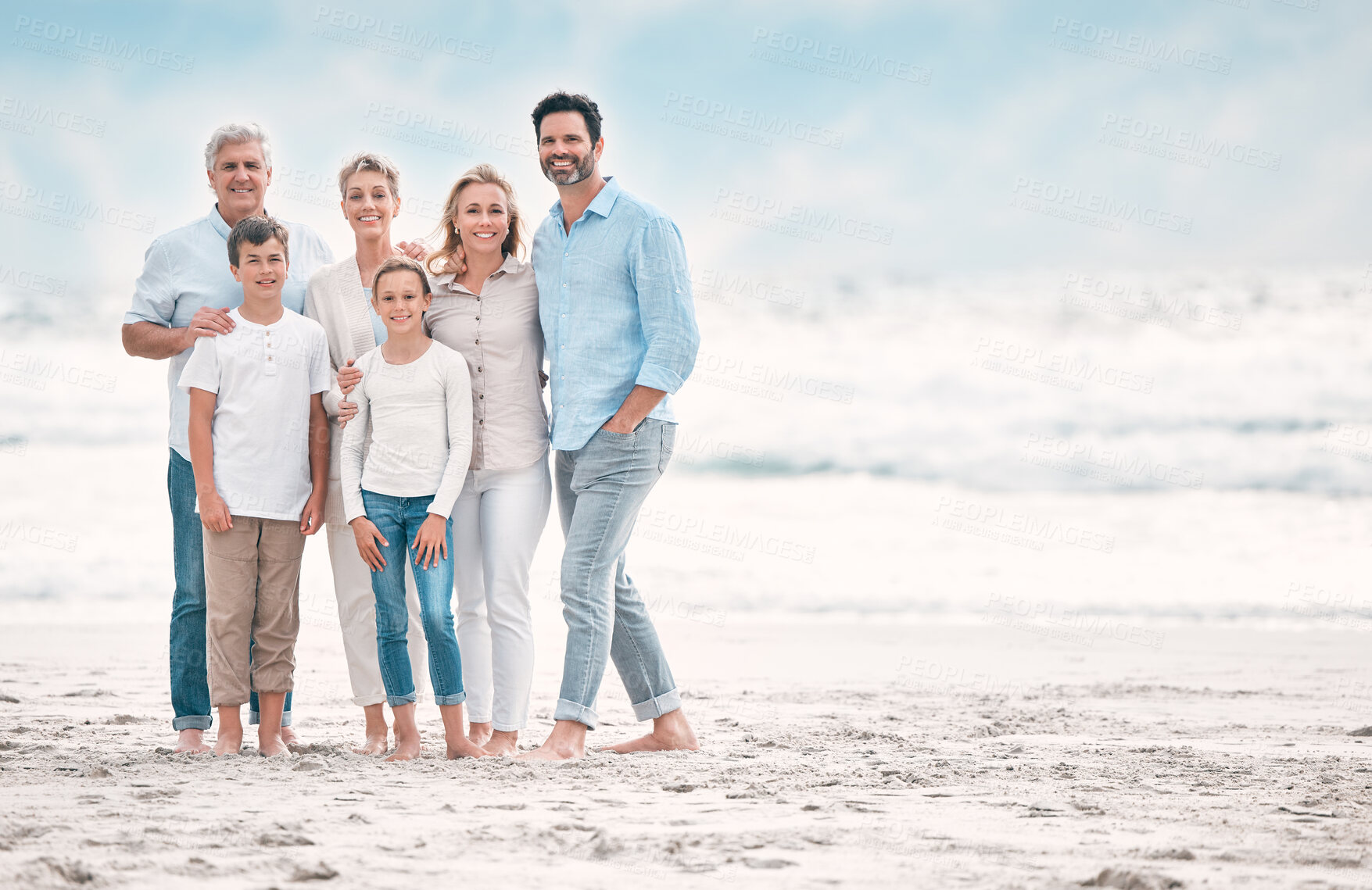 Buy stock photo Love, portrait and smile with family on beach together for holiday, travel or vacation. Hug, mockup space or summer with senior people, parents and sibling children outdoor for bonding or wellness