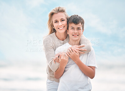 Buy stock photo Shot of a mother and son bonding at the beach