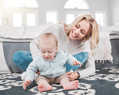 Buy stock photo Mother, love and happy baby on carpet playing together for development or quality time bonding at home. Parent smile, care and support or helping newborn play on floor for happiness in family home