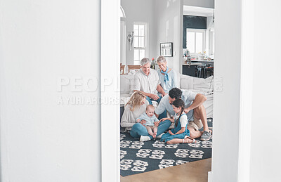 Buy stock photo Big family, relax and children playing in living room, relax and happy in their home together. Content grandparents, parents smile and enjoy fun and kids play on floor while resting on couch in house