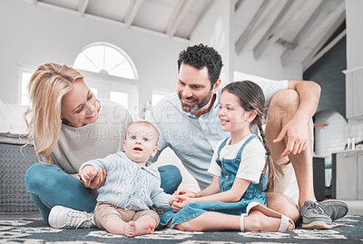 Buy stock photo Family, bonding and family home for relaxing and fun together with love, care and affection. Caring mother and father bond with loving, cute children and baby relax on the floor for leisure