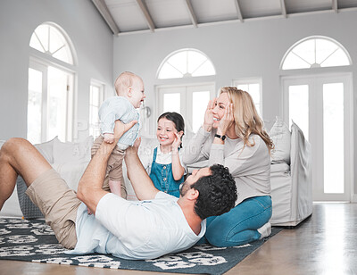 Buy stock photo Happy family, baby kids and parents on living room floor, house and lounge for relax, fun game or quality time together. Mother, father and excited children playing in family home, love and happiness