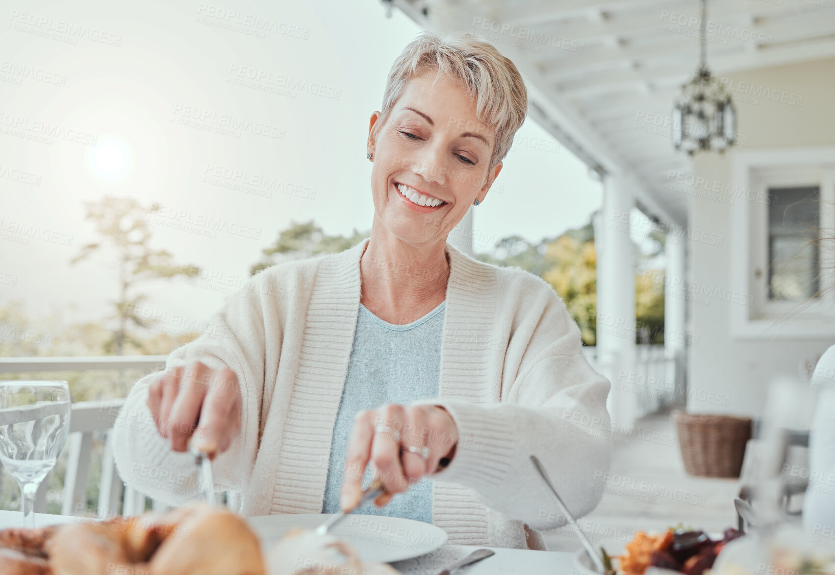 Buy stock photo Shot of a mature woman having lunch at home