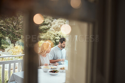 Buy stock photo Shot of a couple having lunch at home