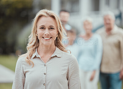 Buy stock photo Shot of a mature woman standing in the garden at home