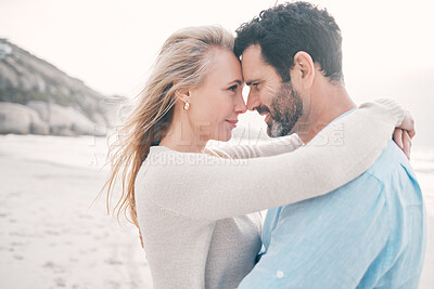 Buy stock photo Beach, love and couple touching head on holiday, vacation and romantic weekend for anniversary. Intimacy, marriage and happy mature man hugging woman for bonding, quality time and happiness by ocean