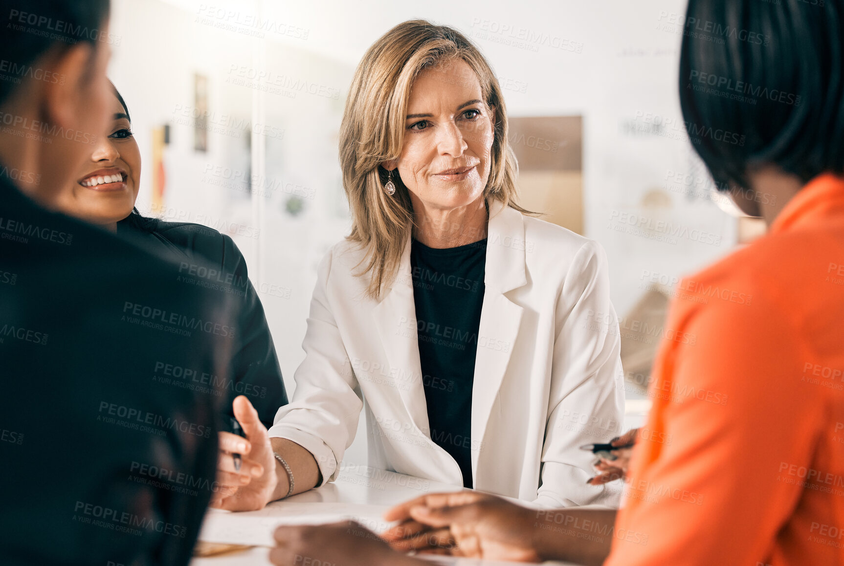 Buy stock photo Shot of a group of businesswomen in a meeting at work