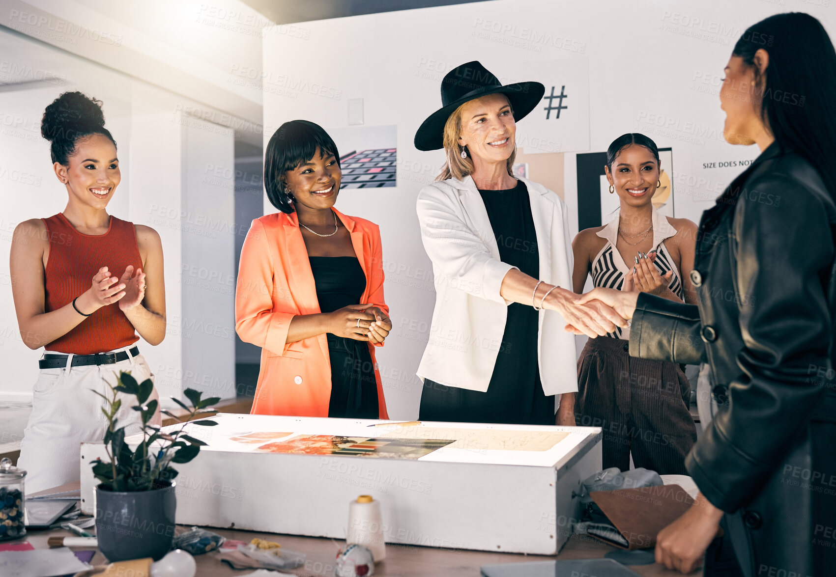 Buy stock photo Fashion, handshake and women with collaboration for small business design mentorship. Creative workshop, tailor and designer in partnership with smile, help and boutique clothes agreement together