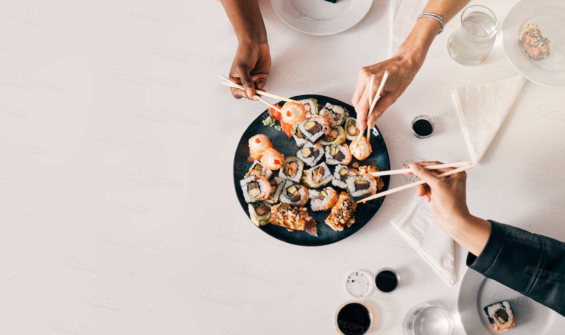 Buy stock photo Above, sushi or hands of people with chopsticks for lunch, luxury meal or takeaway food in office. Japanese cuisine, utensils or women at table for sharing, high quality catering or business expense