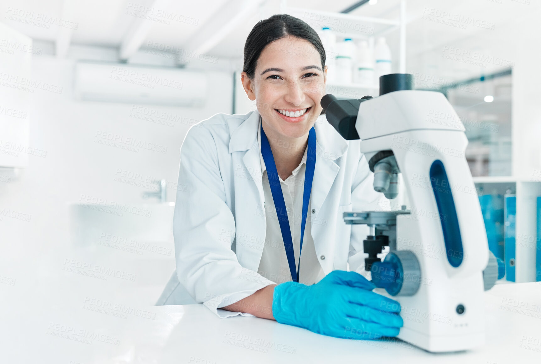 Buy stock photo Microscope, happy woman and portrait of scientist for science breakthrough, clinical trial or discovery. Biotechnology, medical test or vaccine research in laboratory with smile for cure in Turkey