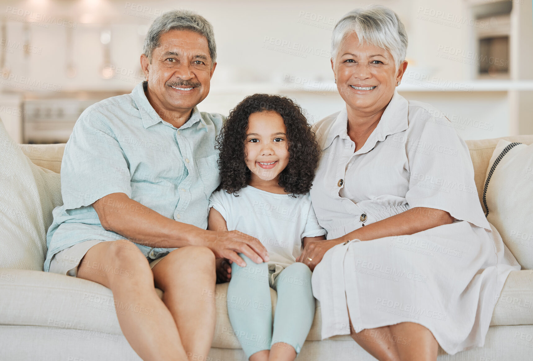 Buy stock photo Smile, relax and portrait of child with grandparents on sofa for bonding, connection or care in home. Happy, love and girl kid with senior man and woman on sofa in living room of family house.