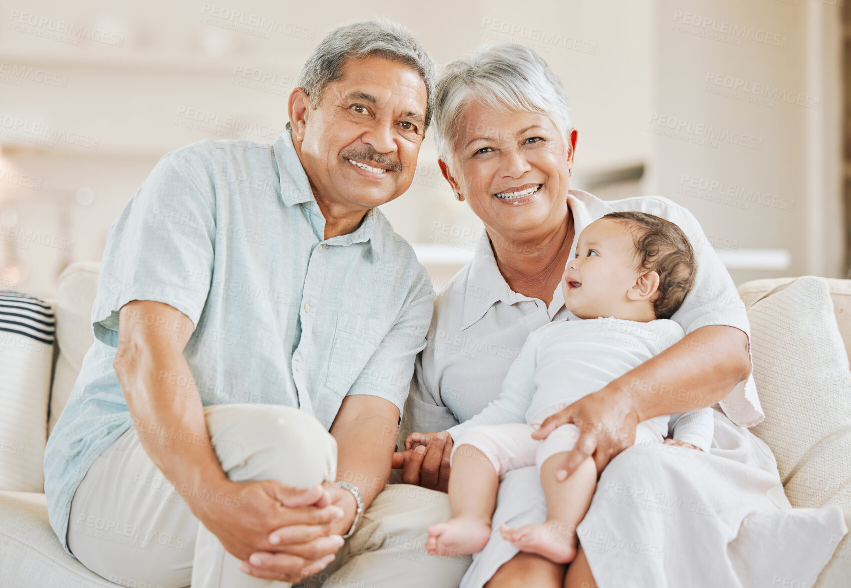 Buy stock photo Smile, sofa and portrait of grandparents with baby in home for bonding, connection or family time. Happy, love and senior man and woman holding and having fun with infant kid in living room at house.