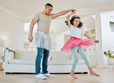 Buy stock photo Shot of a father dancing with his daughter in the living room at home