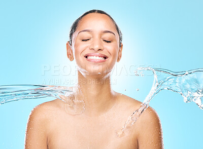 Buy stock photo Studio shot of clean water splashing against a woman's skin