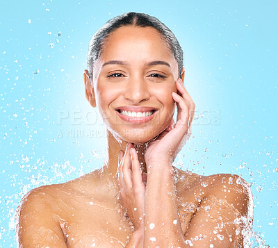 Buy stock photo Studio shot of clean water splashing against a woman's skin