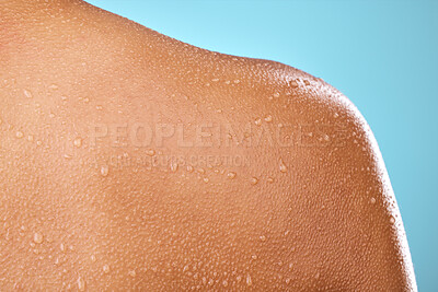 Buy stock photo Studio shot of a woman posing with water droplets on her back