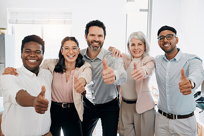 Buy stock photo Shot of a diverse group of businesspeople standing in the office and showing a thumbs up