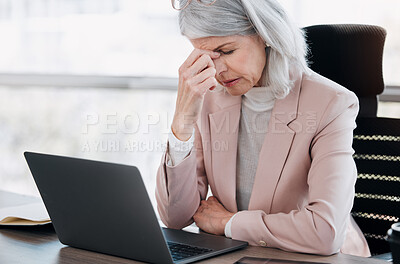 Buy stock photo Mature woman, headache and strain with laptop for stress, bankruptcy or vertigo at office desk. Frustrated, female person or employee with pain or fatigue for pressure, debt or mistake at workplace