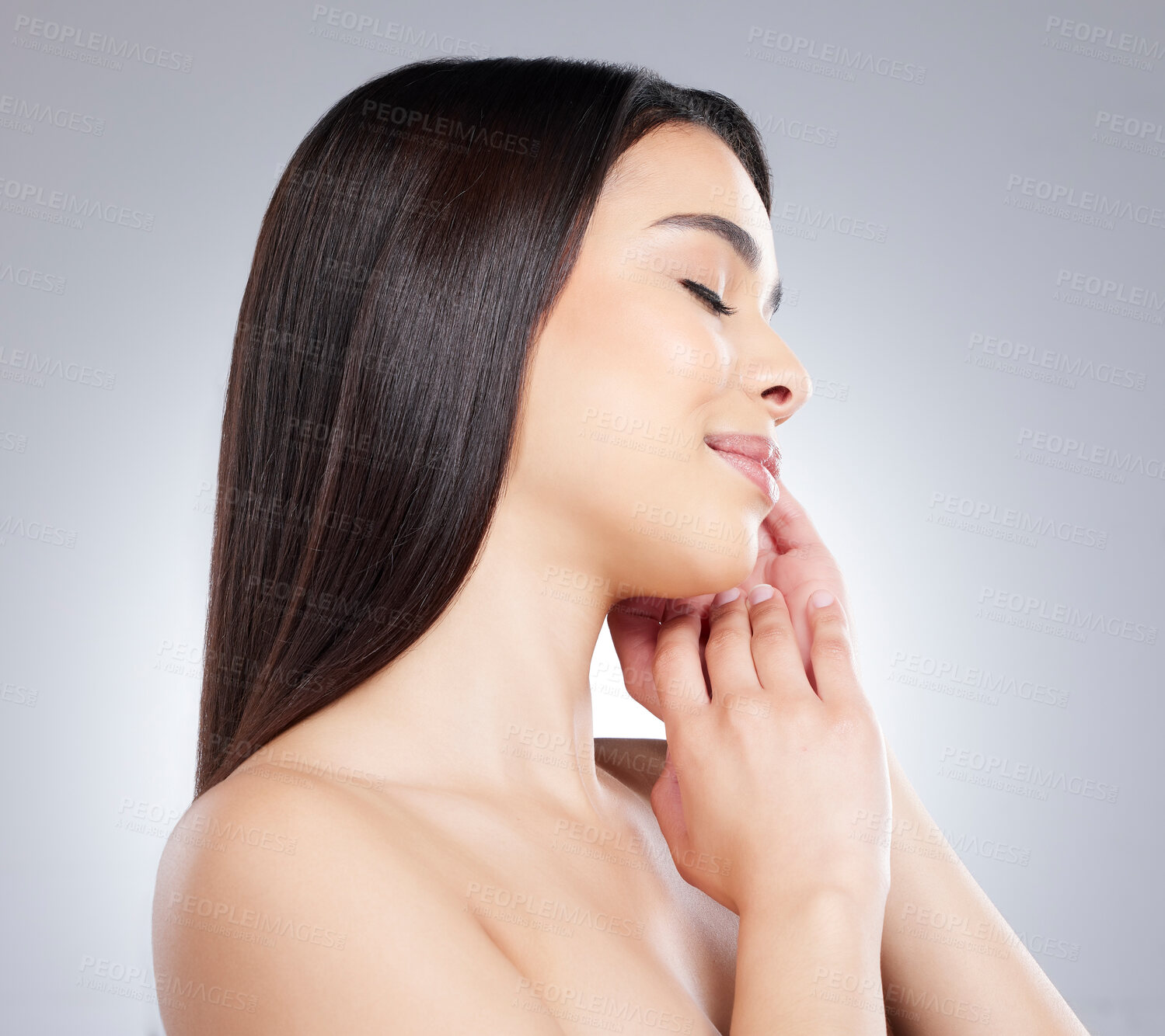 Buy stock photo Studio shot of an attractive young woman posing against a grey background