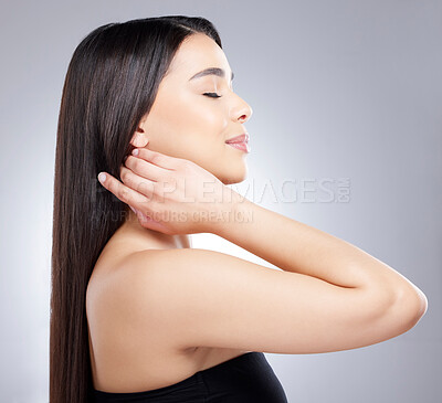 Buy stock photo Studio shot of an attractive young woman posing against a grey background