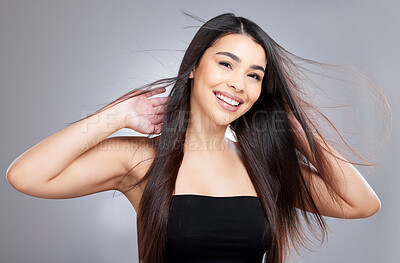 Buy stock photo Girl, wind and hair care in studio for salon, hairdresser and beauty with haircut on white background. Woman, smile and portrait with healthy texture, wellness or treatment with growth transformation