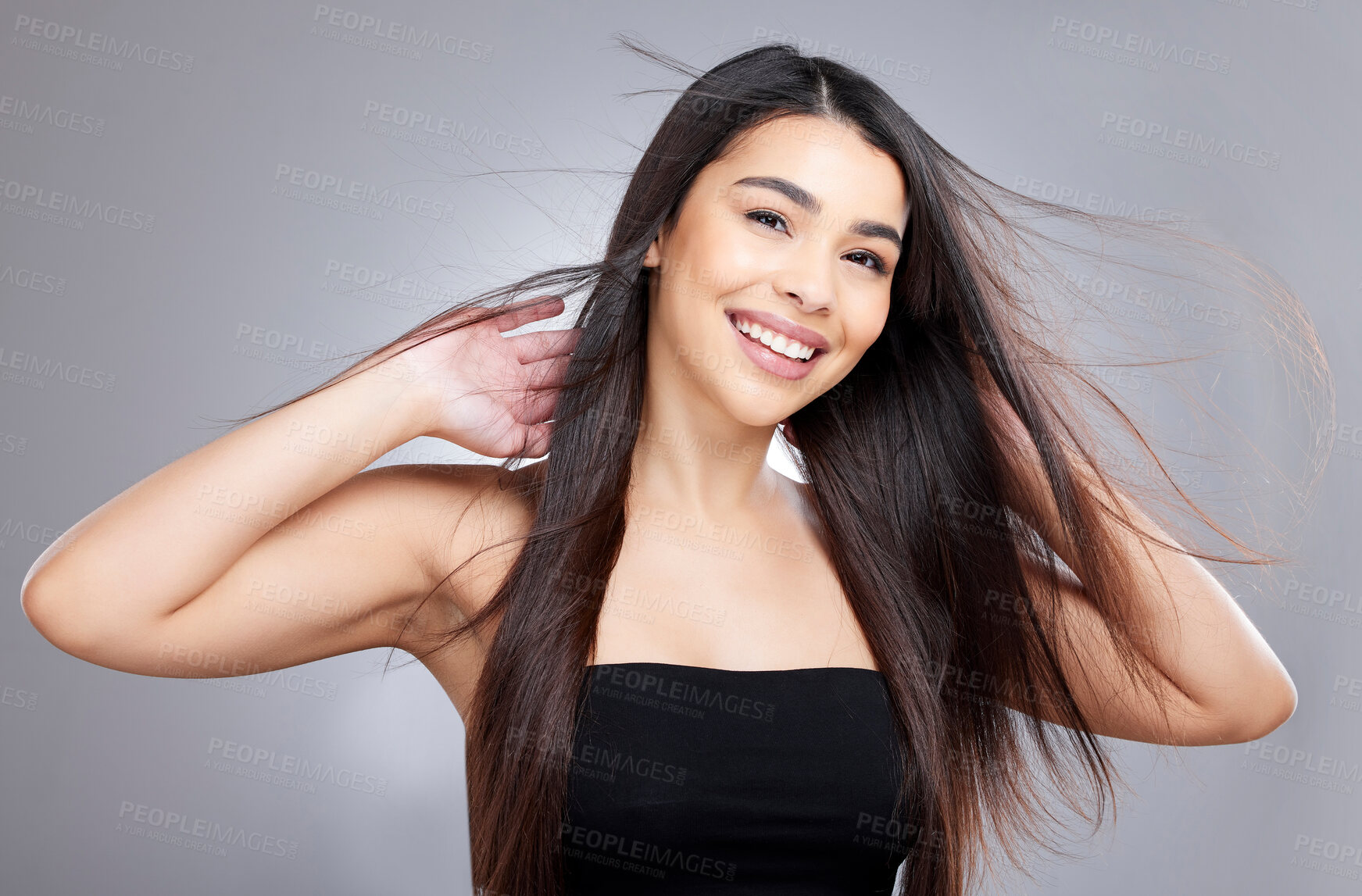 Buy stock photo Girl, wind and hair care in studio for salon, hairdresser and beauty with haircut on white background. Woman, smile and portrait with healthy texture, wellness or treatment with growth transformation