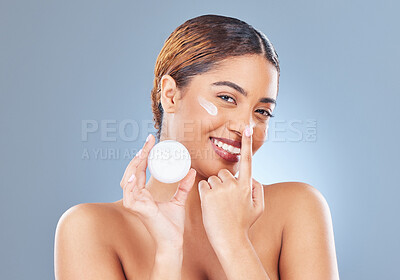 Buy stock photo Portrait, cream or woman with skincare, cosmetics or dermatology on blue studio background. Face, person or model with creme, benefits or lotion for beauty, grooming routine or wellness with smile