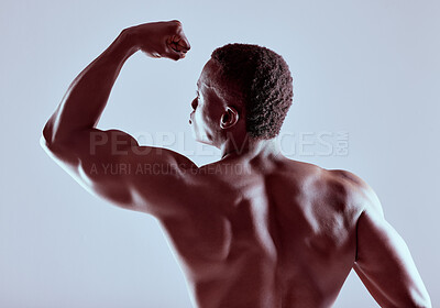 Buy stock photo Shot of an unrecognizable  muscular man posing nude against a grey background