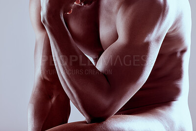 Buy stock photo Shot of an unrecognizable  muscular man posing nude against a grey background