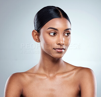 Buy stock photo Cropped shot of an attractive young woman posing in studio against a grey background