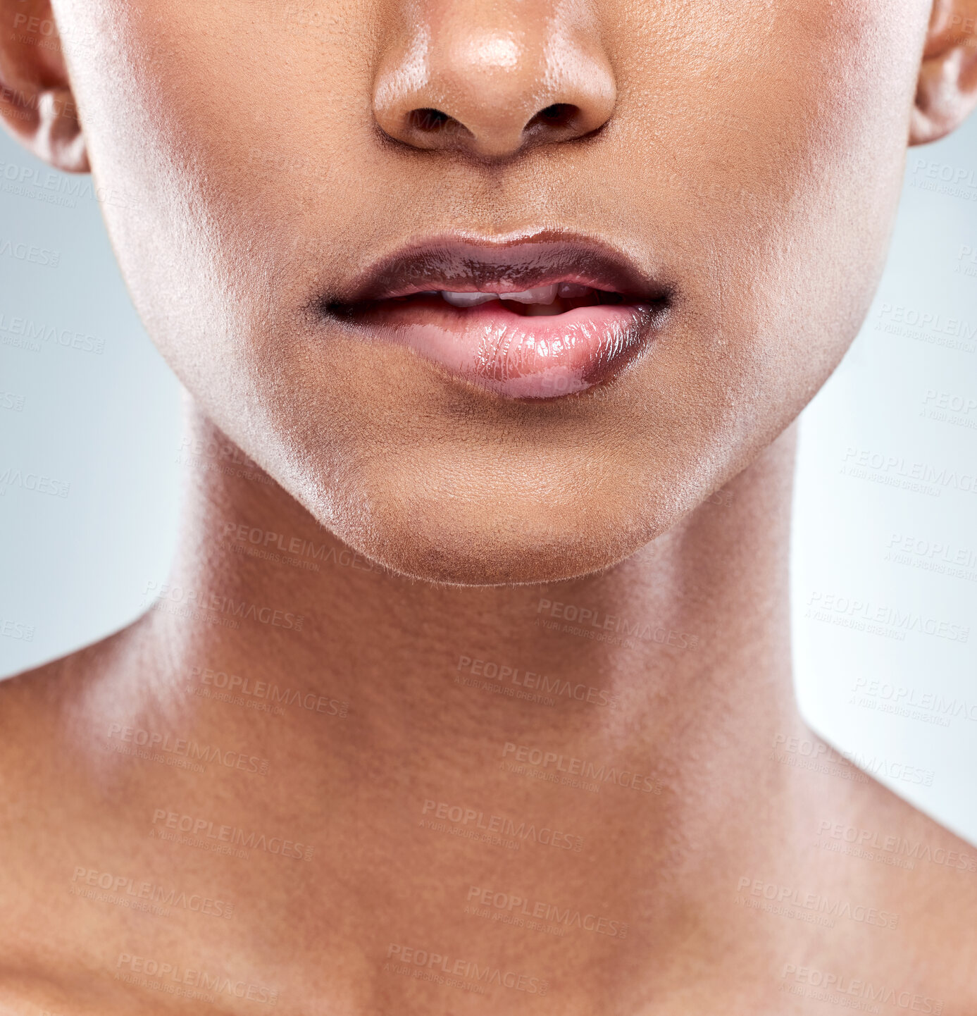 Buy stock photo Closeup shot of an unrecognizable young woman posing in studio against a grey background