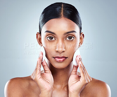 Buy stock photo Portrait, Indian woman and skincare or cleansing, cotton pads and pamper for white background. Cosmetology, studio or hygiene routine for spot control, retinol or hyaluronic acid for female person