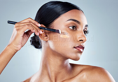 Buy stock photo Makeup brush, foundation and woman with cosmetics, natural beauty and skincare. Cosmetic, young female model and self care with contour and face product with highlighter for skin glow in studio