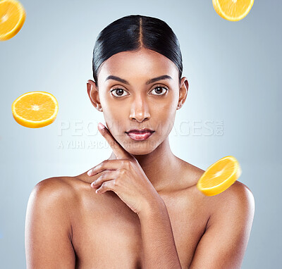 Buy stock photo Cropped portrait of an attractive young woman posing in studio against a grey background