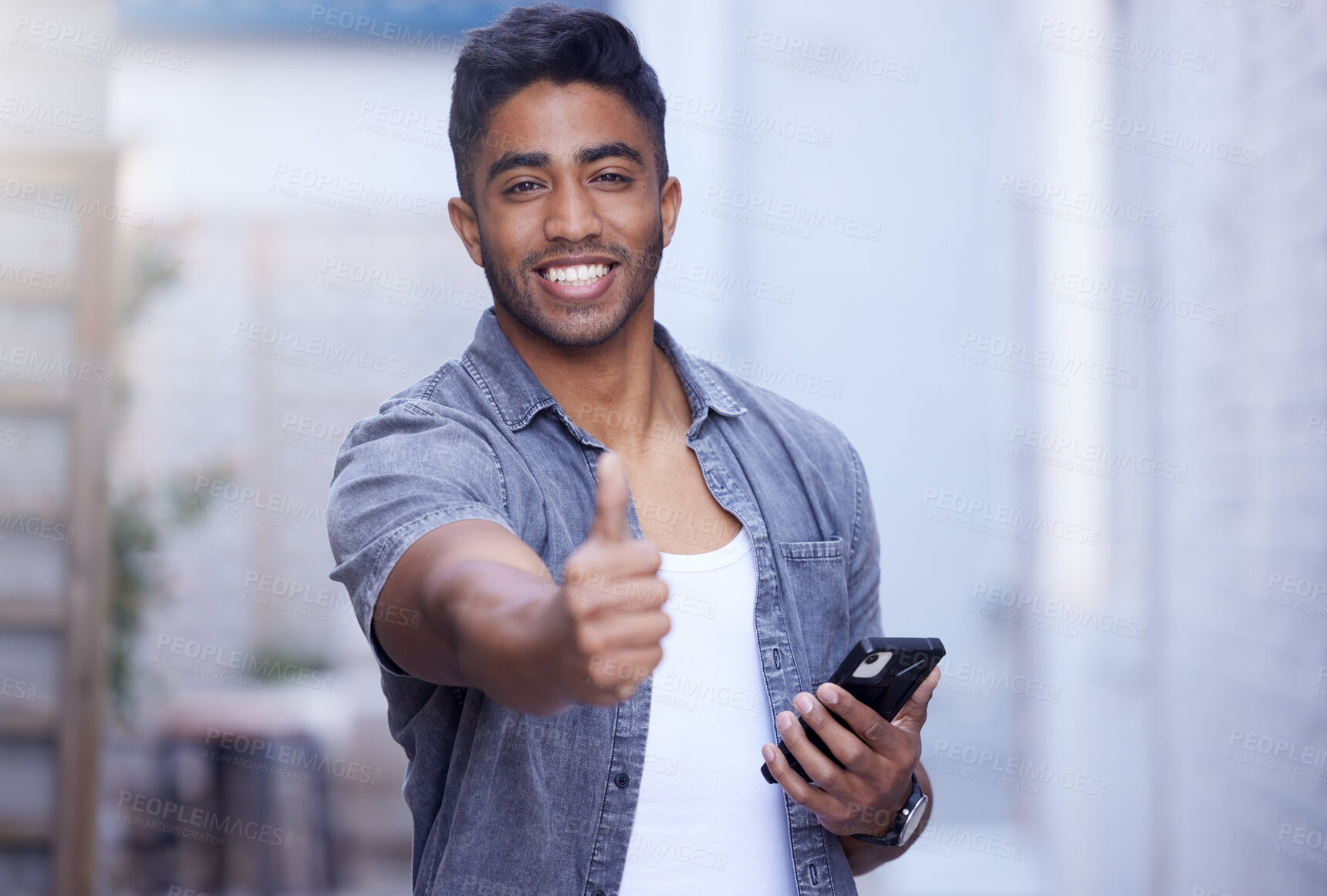 Buy stock photo Indian man, happy and hand with thumbs up and smartphone for good news, feedback or triumph. Smile, male person and finger for agreement, victory and celebration with mobile for contact and connect