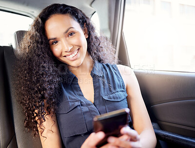 Buy stock photo Portrait of a young businesswoman using a cellphone while travelling in a car