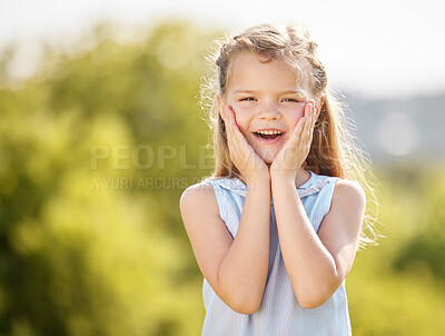 Buy stock photo Shot of a little girl looking surprised against in a park