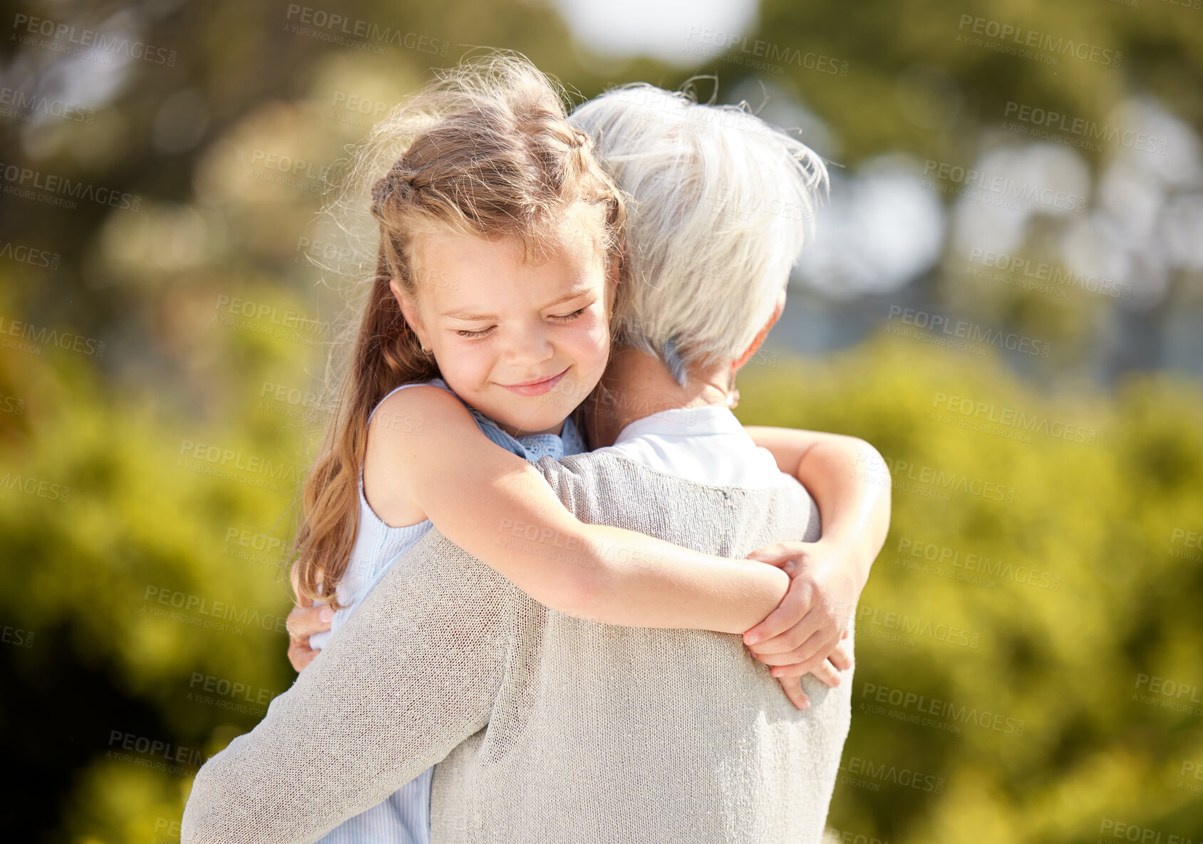 Buy stock photo Hug, love and child with grandma in park for bonding, relationship and relax together on weekend. Family, nature and happy grandmother with young girl embrace for care, affection and trust outdoors